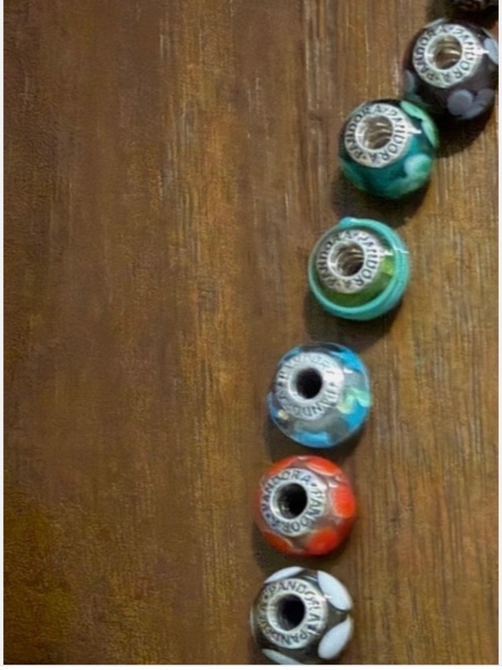 Ten Pandora Murano glass beads